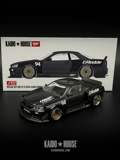 MINI GT 1:64 KHMG222 NISSAN SKYLINE GT-R (R34) KAIDO WORKS GREDDY V2 – BLACK WITH CARBON
